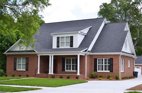 black metal roof red brick house|red brick house roof colours.